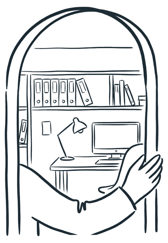 A study seen through an open doorway: shelves, a desk, a computer and a lamp.